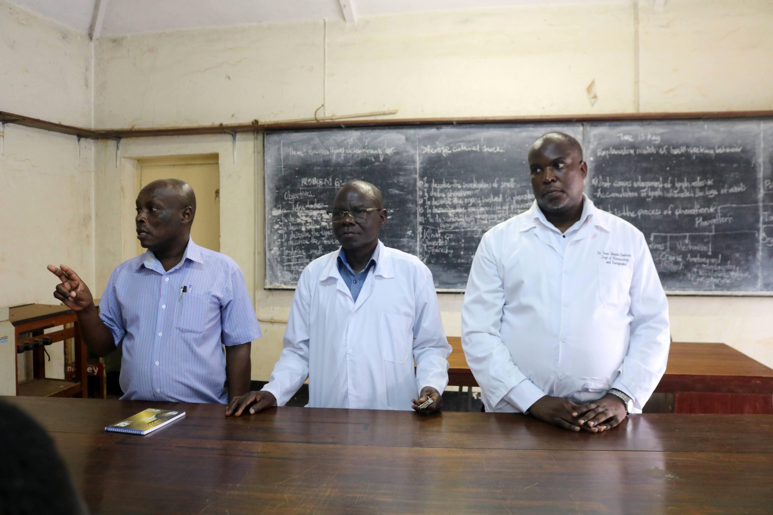 Dr. Isaac Magulu Kimbowa from the Department of Pharmacology and Therapeutics (Right) and colleagues interact with the students. Makerere University College of Health Sciences (MakCHS) Career Fair for Ngora High School and Wiggins Secondary School guiding senior six science students on careers in health sciences and introducing them to the wide range of academic programmes offered by the College, 10th July 2026, Mulago Hospital Complex, Kampala Uganda, East Africa.
