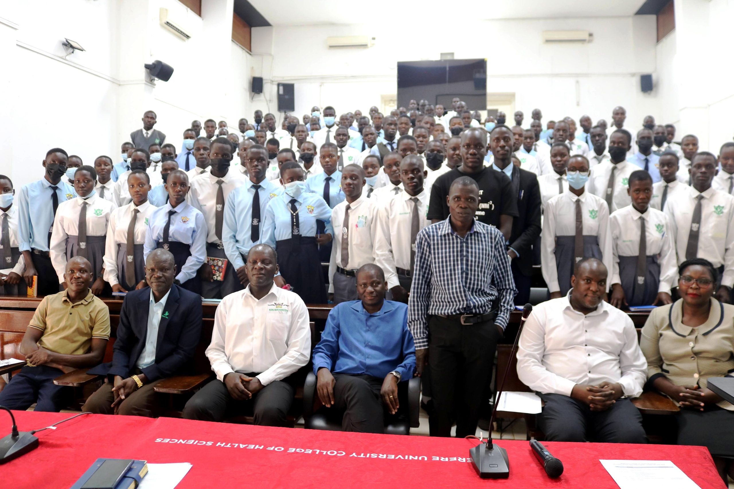 Students and Teachers pose for a group photo with CHS staff. Makerere University College of Health Sciences (MakCHS) Career Fair for Ngora High School and Wiggins Secondary School guiding senior six science students on careers in health sciences and introducing them to the wide range of academic programmes offered by the College, 10th July 2026, Mulago Hospital Complex, Kampala Uganda, East Africa.