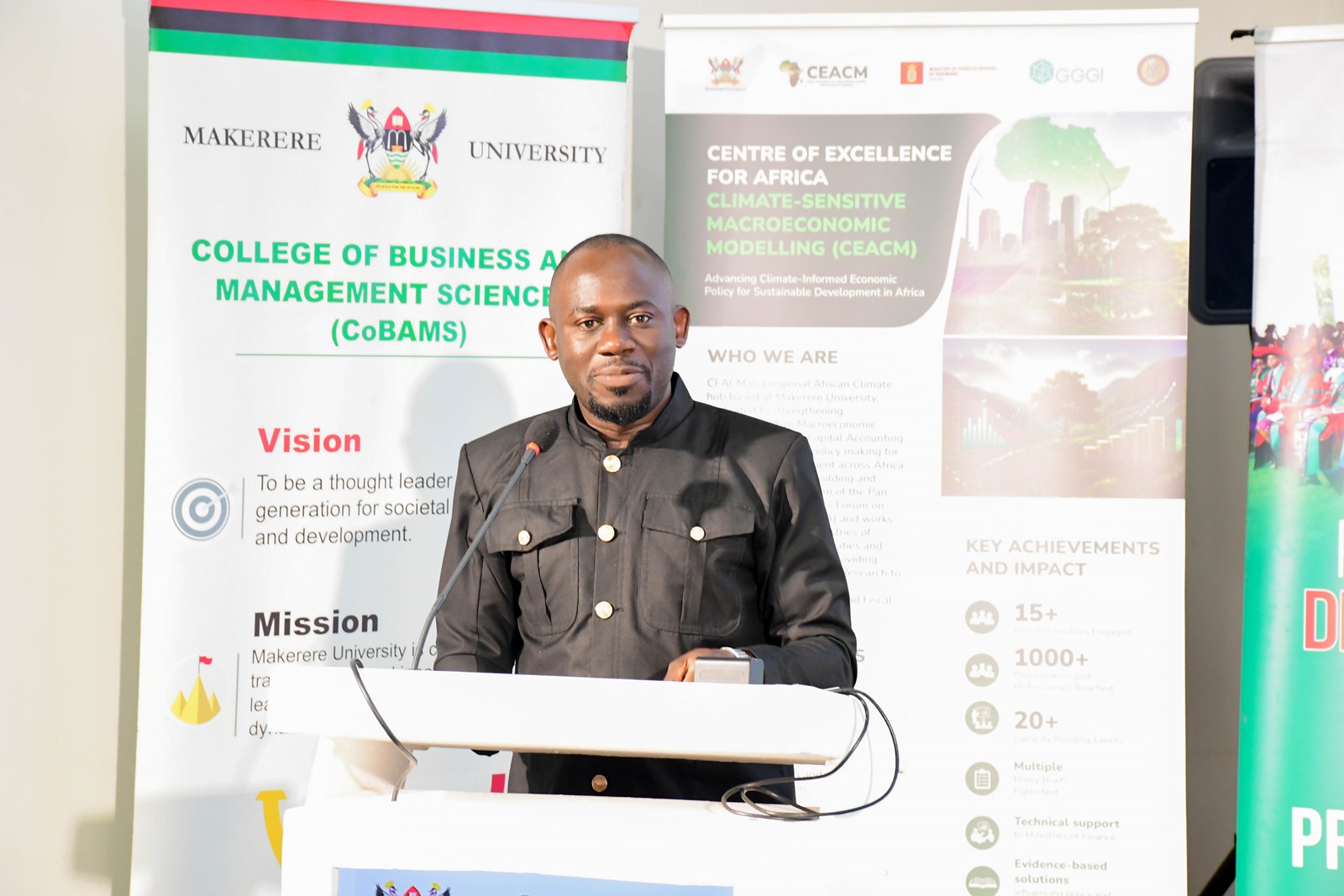 Dr. Peter Babyenda, Coordinator of CEACM, presenting the key findings of the policy briefs during the dissemination event. Launch of Policy Briefs developed by the Centre of Excellence for Africa Climate-Sensitive Macroeconomic Modelling (CEACM), College of Business and Management Sciences (CoBAMS), 15th July 2026, Senior Common Room, Main Building, Makerere University, Kampala Uganda, East Africa.