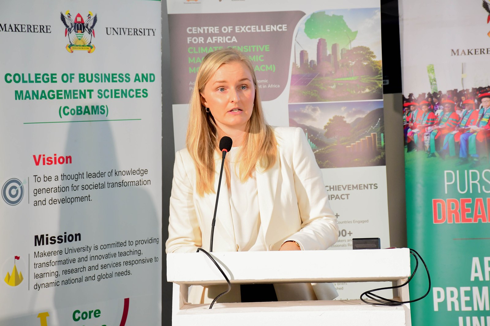 Ms. Nina Guldbæk van Leeuwen, representing the Embassy of Denmark in Uganda, sharing his remarks. Launch of Policy Briefs developed by the Centre of Excellence for Africa Climate-Sensitive Macroeconomic Modelling (CEACM), College of Business and Management Sciences (CoBAMS), 15th July 2026, Senior Common Room, Main Building, Makerere University, Kampala Uganda, East Africa.
