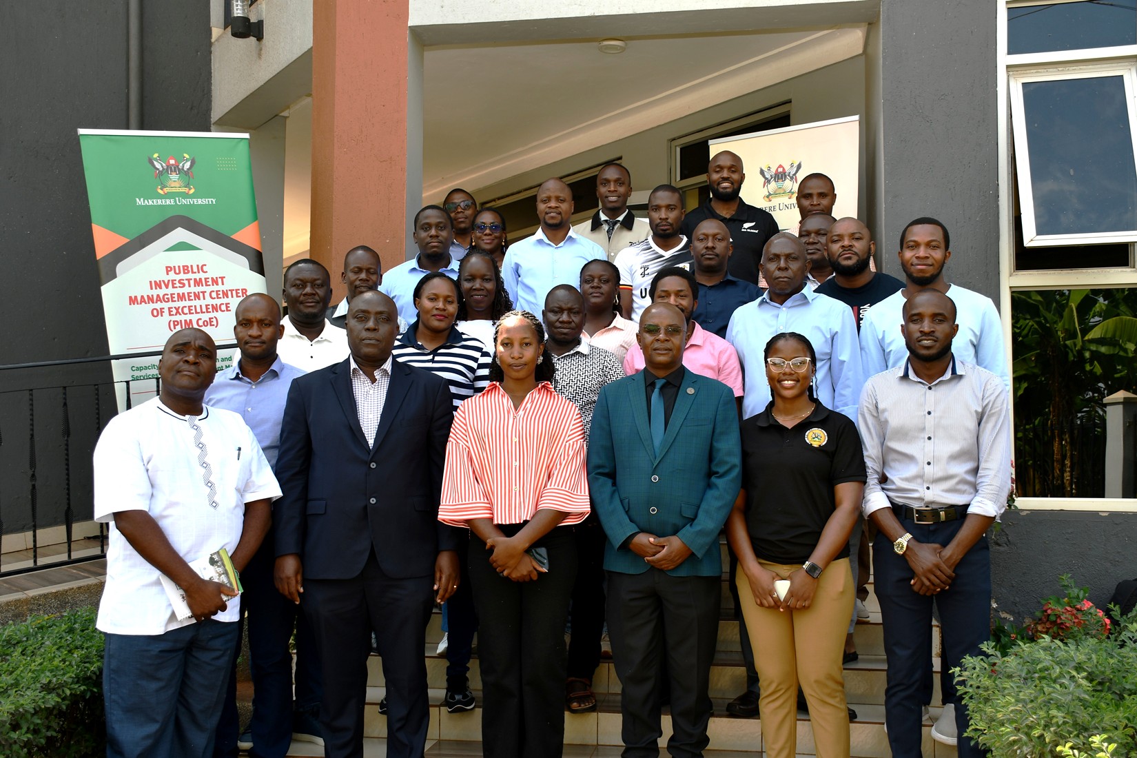 Mr. Henry Mwanja and Prof. Edward Bbaale pose for a group photo with participants on 3rd July 2026. Public Investment Management Centre of Excellence (PIM CoE), Makerere University, Kampala in partnership with the Ministry of Finance, Planning and Economic Development (MoFPED) graduation of two-week training of the fourth cohort of the Capacity Enhancement and Hands-on Training on the Guidelines for Financial Clearance and the Certificate of Financial Implications (CFI) – Integrated Regulatory Cost-Benefit Analysis. 3rd July 2026, Pearl on the Nile Hotel, Jinja, Uganda, East Africa.