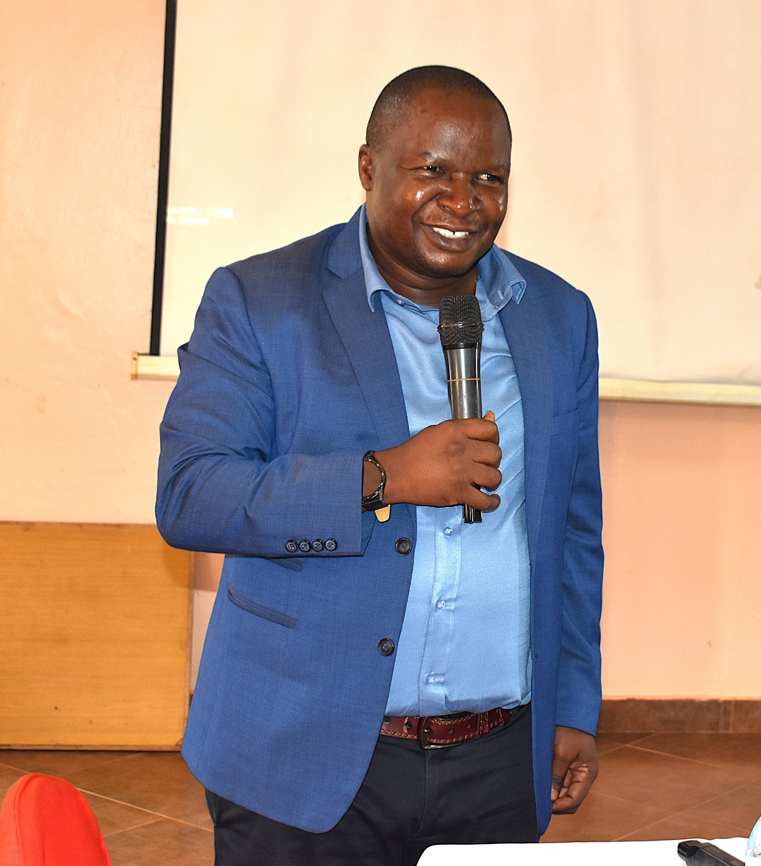 Dr. Godfrey Kawooya Kubiriza, Coordinator of the training and the CBET Programme addressing participants on the first of the workshop at Ridar Hotel in Seeta. College of Natural Sciences (CoNAS), Makerere University, capacity-building training for academic and technical staff to deepen their understanding of CBET principles and equip them with the skills required to design, deliver, and assess competency-based curricula, conducted with support from the Strengthening Commercial Aquaculture (SCA) Programme, funded by the Embassy of the Kingdom of the Netherlands in Kampala (EKN) and implemented by the COFAD Consortium (COFAD–ThinkAqua–WUR), 21-23 July 2026, Ridar Hotel, Seeta, Mukono, Uganda, East Africa.