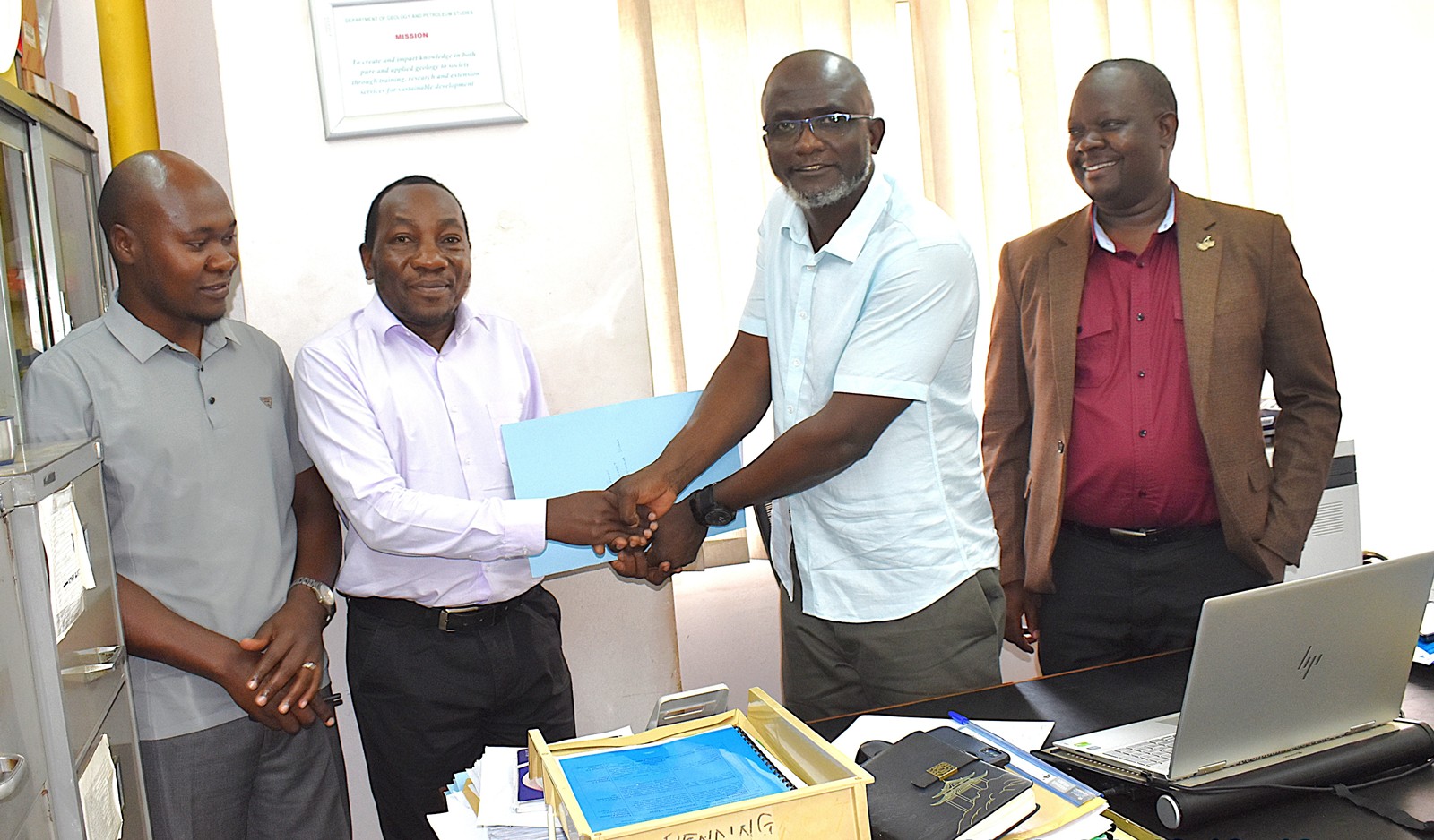 The outgoing Head, Dr Arthur Batte handing over office to Dr John Mary Kiberu on 10th July 2026. The handover was presided over by the Dean of the School of Physical Sciences, Prof. David Ssevviiri (R) and witnessed by Mr Moses Gidongo from the Directorate of Internal Audit, and Ms. Kevin Nabiryo Mikwano, the College Human Resource Officer. Handover from Dr Arthur Batte to Dr John Mary Kiberu, appointed Acting Head of the Department of Geology and Petroleum Studies effective 1st July 2026, presided over by the Dean of the School of Physical Sciences, Prof. David Ssevviiri on 10th July 2026, College of Natural Sciences (CoNAS), Makerere University, Kampala Uganda, East Africa.