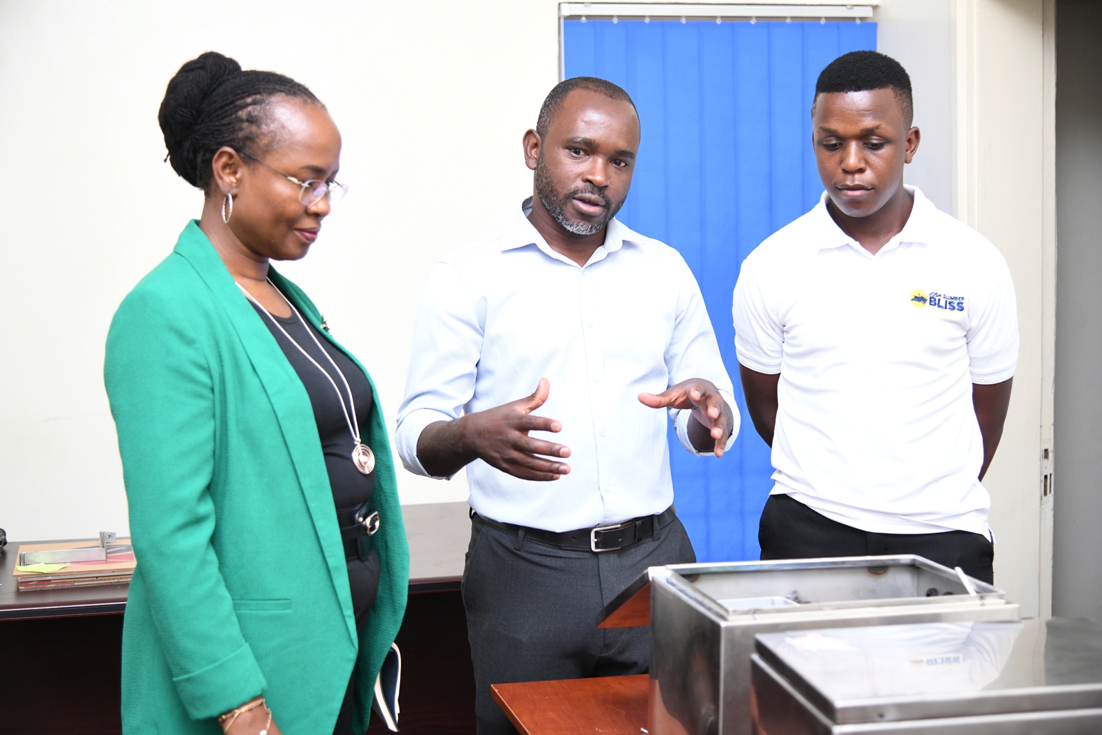 Mr. Nicholas Mbonimpa (C) with Prof. Sarah Ssali (L) and Rt. Hon. Trevis Mutatiina Muhwezi (R). The Deputy Vice Chancellor in charge of Academic Affairs (DVCAA) Prof. Sarah Ssali's guided tour of Research and Education Network for Uganda (RENU)’s Industrial Trainee Program on 15th July 2026, RENU Labs, Edge Road, Makerere University, Kampala Uganda, East Africa.