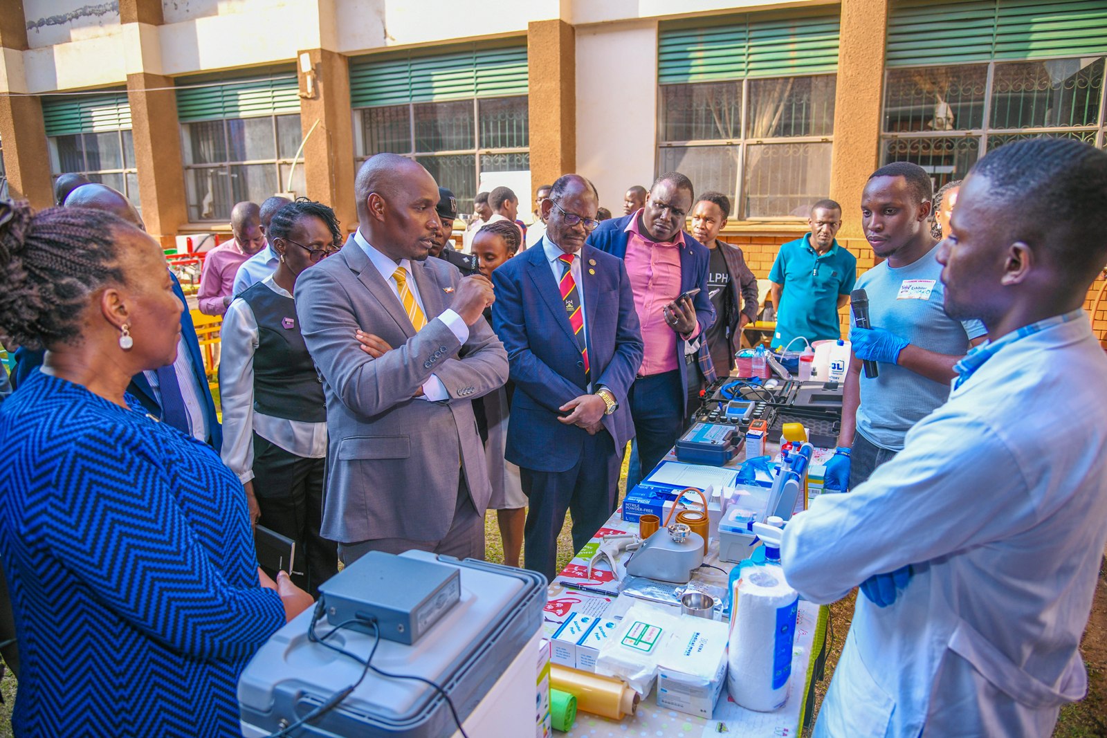 Hon. Eng. Jonard Asiimwe Akiiki accompanied by Prof. Barnabas Nawangwe and other officials interacts with exhibitors at the School of Food Technology, Nutrition and Bioengineering. Hon. Eng. Jonard Asiimwe Akiiki, Minister of Science, Technology and Innovation in the Office of the President, two-day Ministerial Maiden Visit to Makerere University, 21st-22nd July 2026, Kampala Uganda, East Africa.