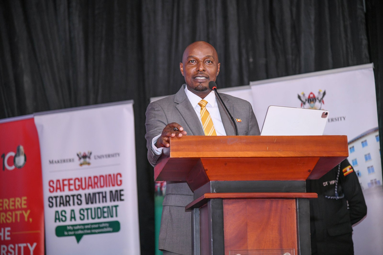 Hon. Eng. Jonard Asiimwe Akiiki addresses participants during the opening session. Hon. Eng. Jonard Asiimwe Akiiki, Minister of Science, Technology and Innovation in the Office of the President, two-day Ministerial Maiden Visit to Makerere University, 21st-22nd July 2026, Kampala Uganda, East Africa.