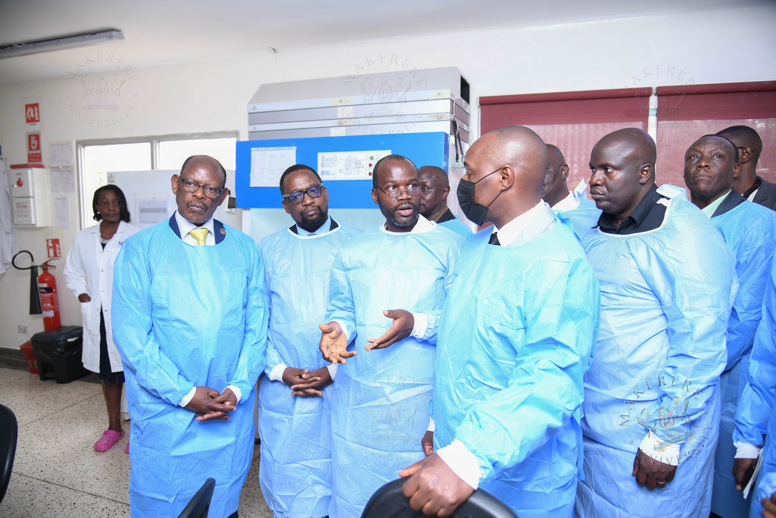 Hon. Eng. Jonard Asiimwe Akiiki interacts with a Member of Staff during his tour of one of the Labs. Hon. Eng. Jonard Asiimwe Akiiki, Minister of Science, Technology and Innovation in the Office of the President, two-day Ministerial Maiden Visit to Makerere University, 21st-22nd July 2026, Kampala Uganda, East Africa.