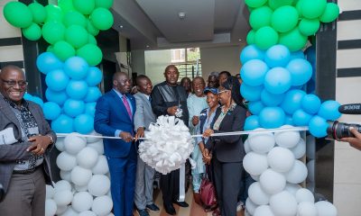 Dr Chris Baryomunsi, flanked by Dr Tolbert Nyenswah, Dr Marie-Roseline Belizaire and Dr Andrew Kambugu, cuts the ribbon marking the launch of the Continental Incident Management Support Team at IDI's McKinnell Knowledge Centre, Makerere University. Formal launch of Continental Incident Management Support Team (IMST), a joint Africa Centres for Disease Control and Prevention (Africa CDC) and World Health Organization (WHO) operation racing to contain the Bundibugyo strain of Ebola sweeping through the Democratic Republic of the Congo, 26th June 2026, Infectious Diseases Institute (IDI) McKinnell Knowledge Centre, Makerere University, Kampala Uganda, East Africa.