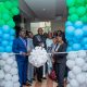 Dr Chris Baryomunsi, flanked by Dr Tolbert Nyenswah, Dr Marie-Roseline Belizaire and Dr Andrew Kambugu, cuts the ribbon marking the launch of the Continental Incident Management Support Team at IDI's McKinnell Knowledge Centre, Makerere University. Formal launch of Continental Incident Management Support Team (IMST), a joint Africa Centres for Disease Control and Prevention (Africa CDC) and World Health Organization (WHO) operation racing to contain the Bundibugyo strain of Ebola sweeping through the Democratic Republic of the Congo, 26th June 2026, Infectious Diseases Institute (IDI) McKinnell Knowledge Centre, Makerere University, Kampala Uganda, East Africa.