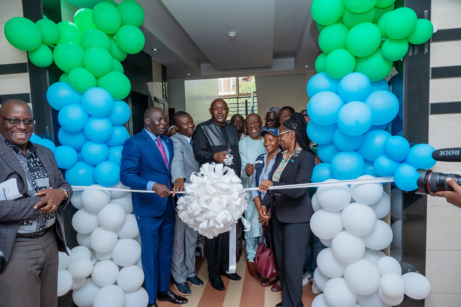 Dr Chris Baryomunsi, flanked by Dr Tolbert Nyenswah, Dr Marie-Roseline Belizaire and Dr Andrew Kambugu, cuts the ribbon marking the launch of the Continental Incident Management Support Team at IDI's McKinnell Knowledge Centre, Makerere University. Formal launch of Continental Incident Management Support Team (IMST), a joint Africa Centres for Disease Control and Prevention (Africa CDC) and World Health Organization (WHO) operation racing to contain the Bundibugyo strain of Ebola sweeping through the Democratic Republic of the Congo, 26th June 2026, Infectious Diseases Institute (IDI) McKinnell Knowledge Centre, Makerere University, Kampala Uganda, East Africa.