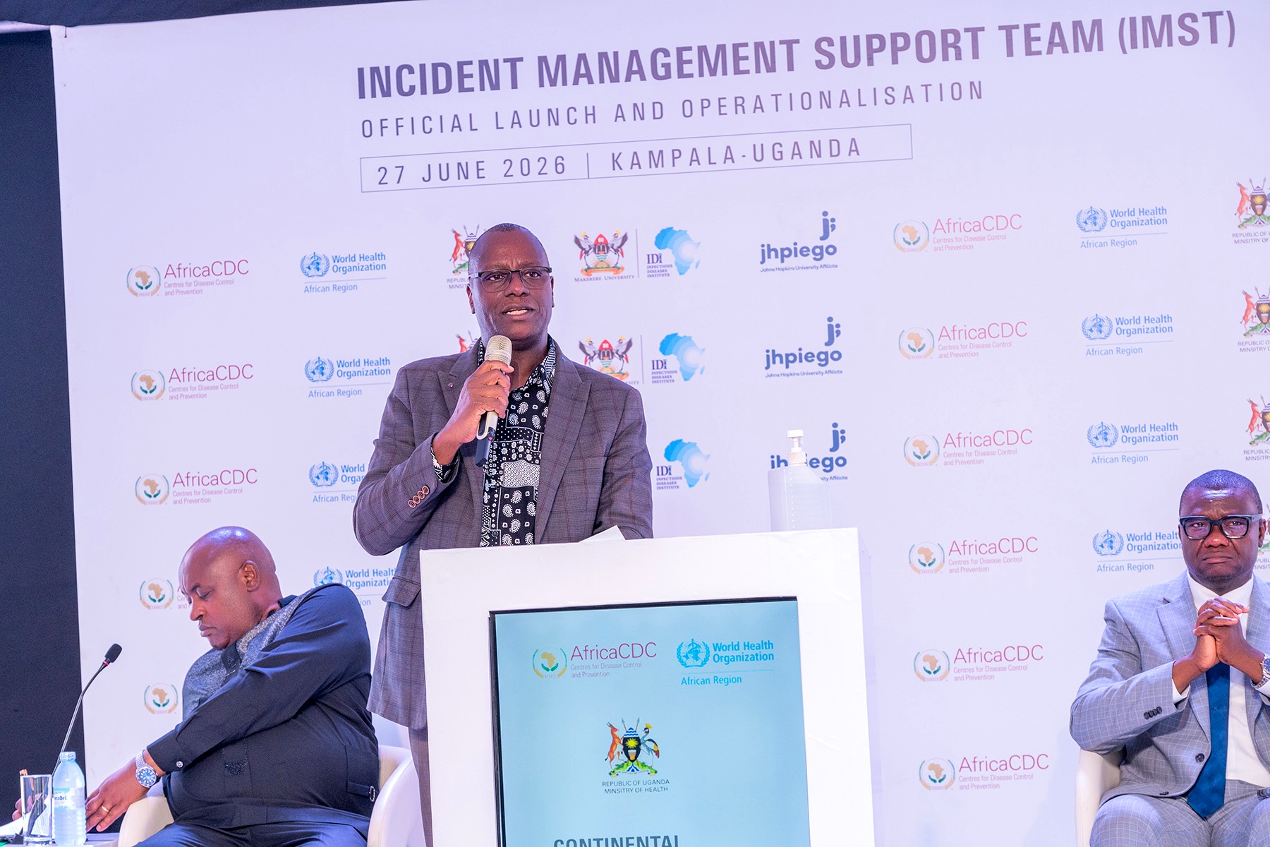 Dr Andrew Kambugu delivers welcome remarks at the launch of the Continental Incident Management Support Team, Infectious Diseases Institute, Makerere University. Formal launch of Continental Incident Management Support Team (IMST), a joint Africa Centres for Disease Control and Prevention (Africa CDC) and World Health Organization (WHO) operation racing to contain the Bundibugyo strain of Ebola sweeping through the Democratic Republic of the Congo, 26th June 2026, Infectious Diseases Institute (IDI) McKinnell Knowledge Centre, Makerere University, Kampala Uganda, East Africa.