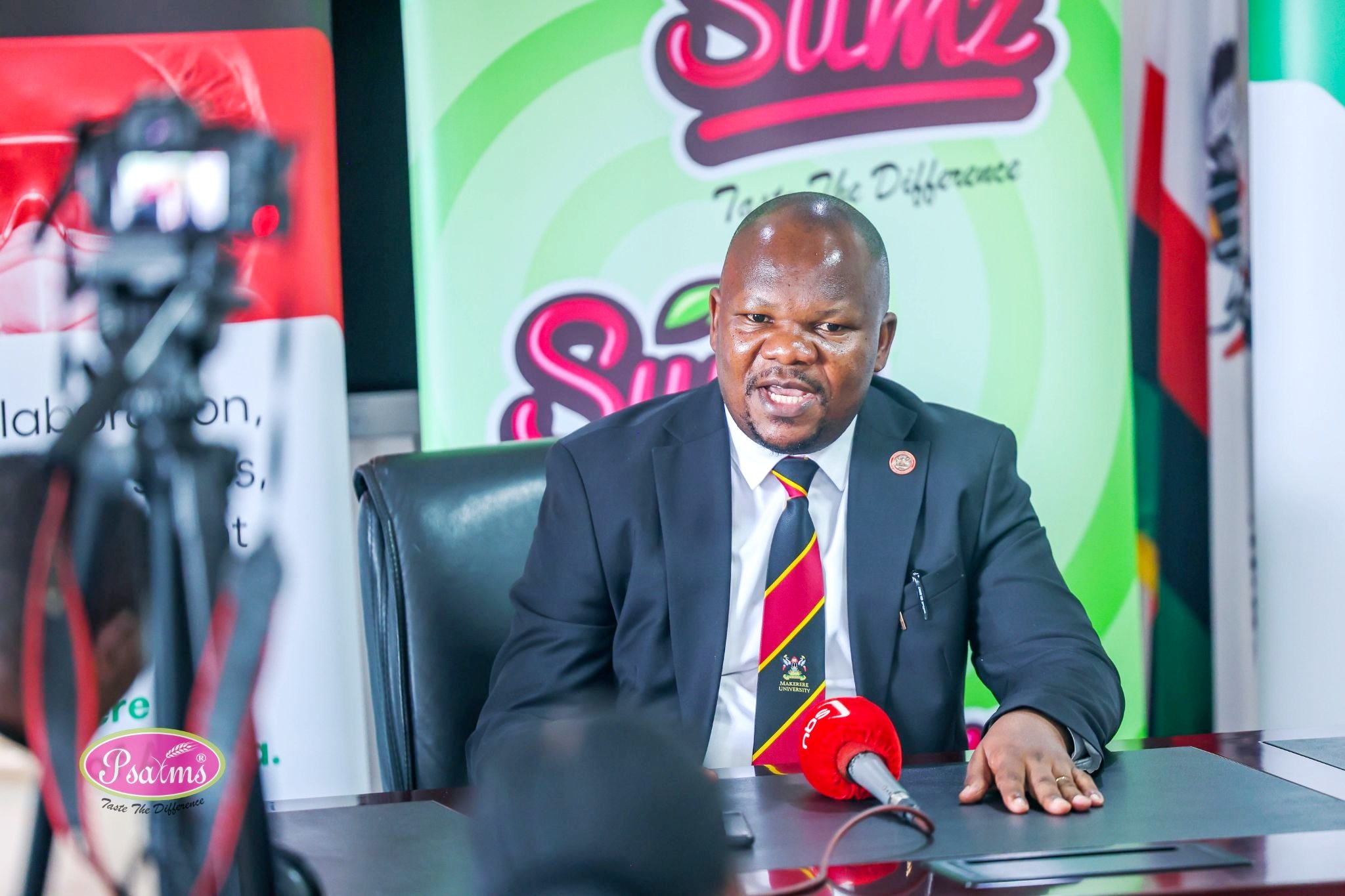 Dr. Dennis Ngabirano addressing the media during the ceremony. DVCAA Professor Sarah Ssali signs Memorandum of Understanding (MoU) with Psalms Food Industries Ltd, marking the beginning of a strategic partnership aimed at strengthening collaboration between academia and industry through research, innovation, entrepreneurship and experiential learning, 21st July 2026, Main Building, Makerere University, Kampala Uganda, East Africa.