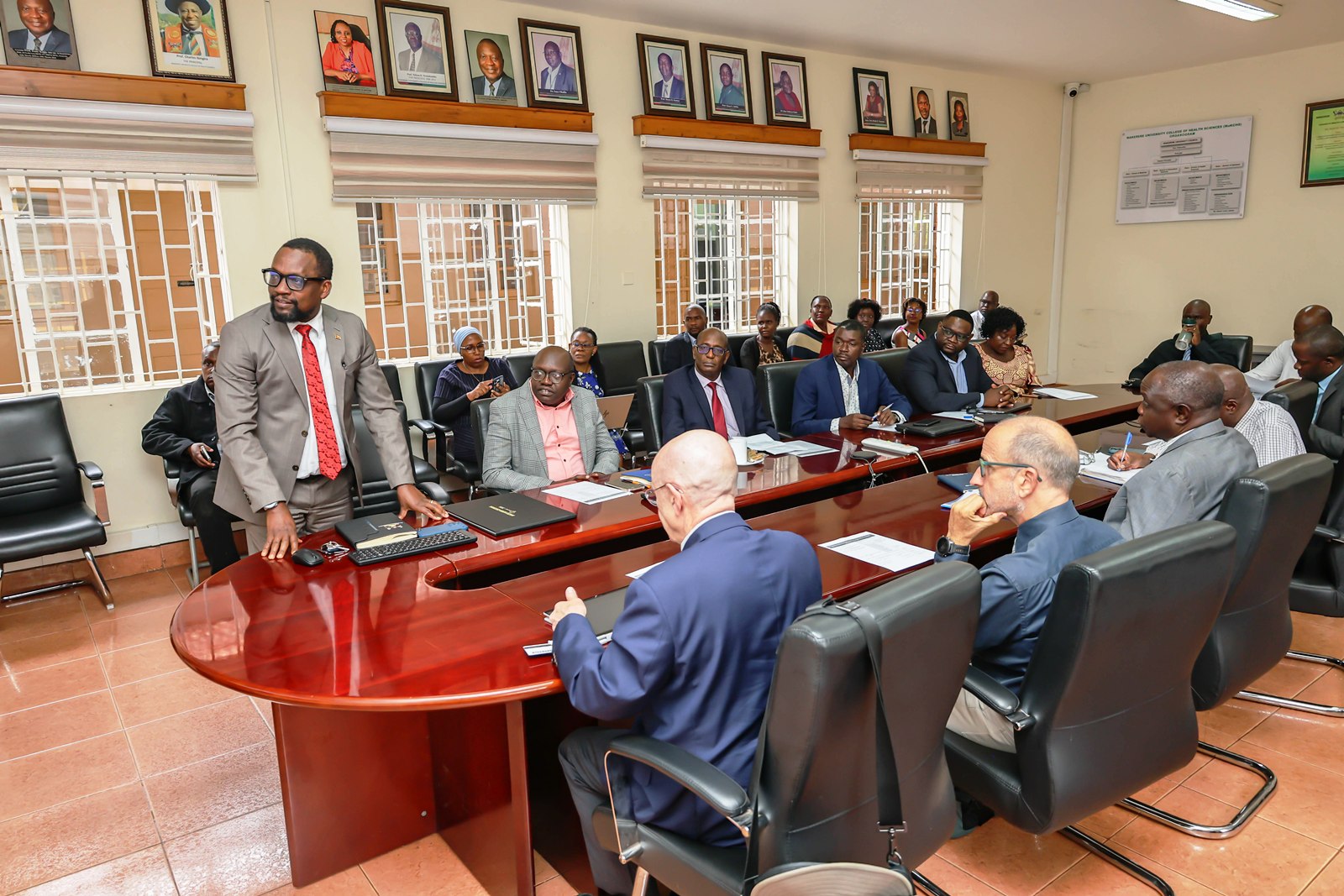 Prof. Bruce Kirenga (Standing) makes his remarks. Makerere University College of Health Sciences (MakCHS) hosts Director of the NIH Fogarty International Center (FIC), Dr. Steven Schiff, 5th August 2026, Mulago Hospital Complex, Kampala Uganda, East Africa.