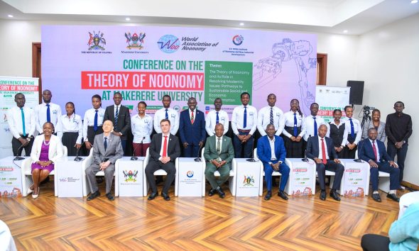 Seated L-R: Prof. Sarah Ssali, Mr. Sergey Lobanov-Head of Mission, Russian Embassy in Uganda, Prof. Nikolay D. Dmitriev, Prof. Edward Bbaale, Dr. Robert Ngobi, Mr. Davis Vuningoma and Prof. Ibrahim Mike Okumu with Dr. Peter Babyenda and CoBAMS Students (Standing) on 20th August 2026. College of Business and Management Sciences (CoBAMS) supported by the Makerere University Research and Innovations Fund (Mak-RIF) in collaboration with the Witte Institute for New Industrial Development and St. Petersburg Polytechnic University, Russia Conference on The Theory of Noonomy and its Role in Resolving Modernity Issues: Pathways to Sustainable Social and Economic Transformation, 20th Aug 2026, Senior Common Room, Main Building, Makerere University, Kampala Uganda, East Africa