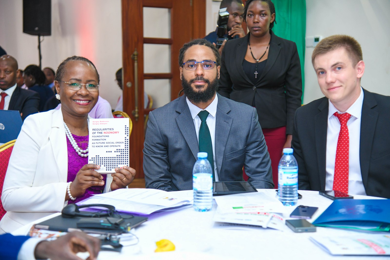 Prof. Sarah Ssali (L) and Prof. Nikolay D. Dmitriev (R) and member of the delegation from Russia (C). College of Business and Management Sciences (CoBAMS) supported by the Makerere University Research and Innovations Fund (Mak-RIF) in collaboration with the Witte Institute for New Industrial Development and St. Petersburg Polytechnic University, Russia Conference on The Theory of Noonomy and its Role in Resolving Modernity Issues: Pathways to Sustainable Social and Economic Transformation, 20th Aug 2026, Senior Common Room, Main Building, Makerere University, Kampala Uganda, East Africa