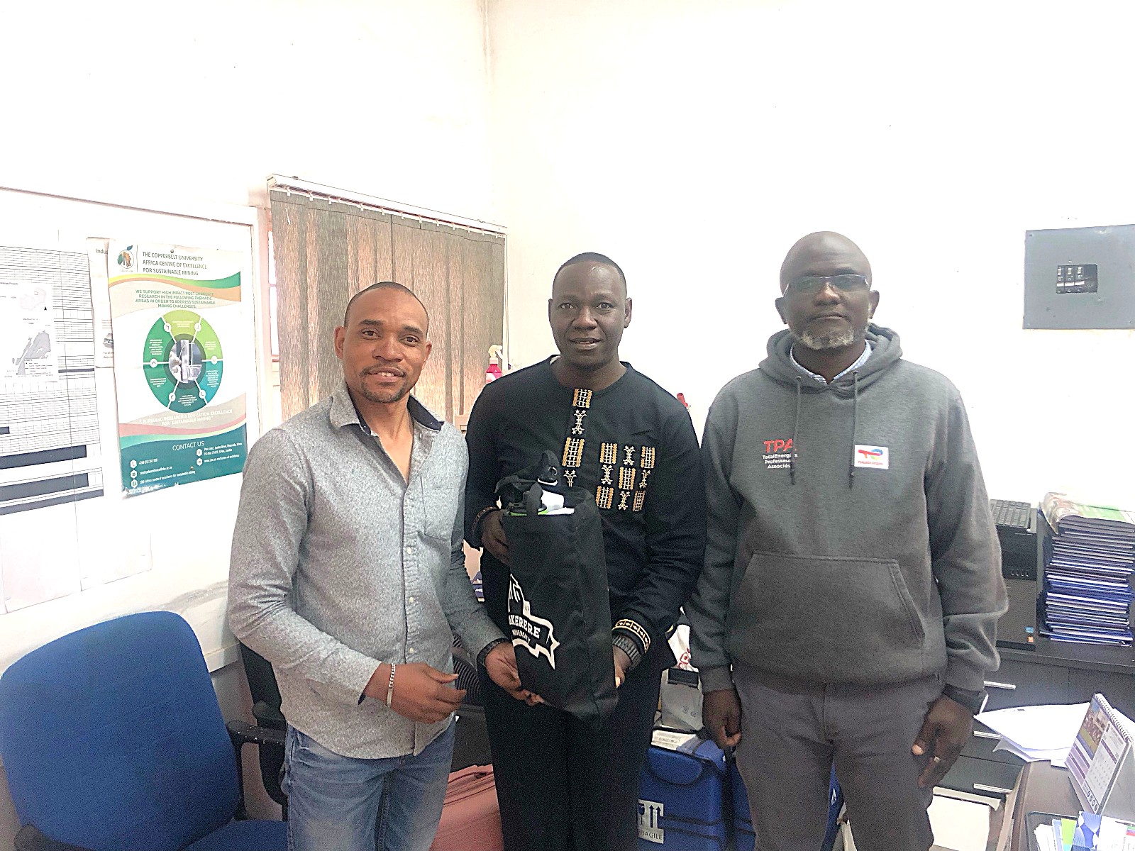 Dr Denis Mutebi and Dr Arthur Batte handing over Makerere University souvenirs to the representative of the Dean of the School of Mines and Mineral Sciences, who also serves as the Head of the Department of Geology at Copperbelt University, Dr Gabriel Ziwa. Strengthening Uganda’s Mineral Sector through Labour-Market Aligned Curricula Reforms: A Comprehensive Review of BSc/MSc/PhD Geology Curricula and Development of Industry-Aligned Short Courses at Makerere University (Mak-SDMU) Project, Makerere University Department of Geology and Petroleum Studies, Ministry of Energy and Mineral Development (MEMD) benchmarking exercise at Copperbelt University (CBU) in Kitwe, Zambia, and the Zimbabwe School of Mines (ZSM), 19th-23rd July 2026.