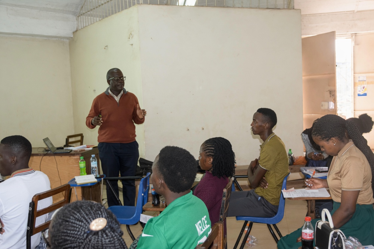 Dr. Kizza, BILB coordinator, addresses new students during orientation at CoVAB, highlighting career opportunities in dairy, poultry, and leather industries. College of Veterinary Medicine, Animal Resources and Biosecurity (CoVAB) orientation for incoming students of the Bachelor of Industrial Livestock Business (BILB) and Bachelor of Agribusiness and Production (BAP) programs, August 6th, 2026, Livestock Industrial Resources (LIR) Department, Makerere University, Kampala Uganda, East Africa.