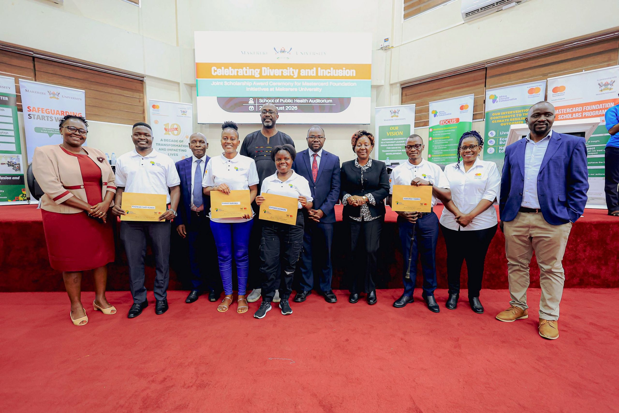Some of the Africa Climate Collaborative Scholars pose for a group photo after receiving their award letters. Award Ceremony for Cohort 2 of 50 young people to pursue Master's studies under the Africa Climate Collaborative, an initiative supported by the Mastercard Foundation for the 2026/2027 academic, 20th August 2026, Makerere University School of Public Health (MakSPH) Auditorium, Main Campus, Kampala Uganda, East Africa.