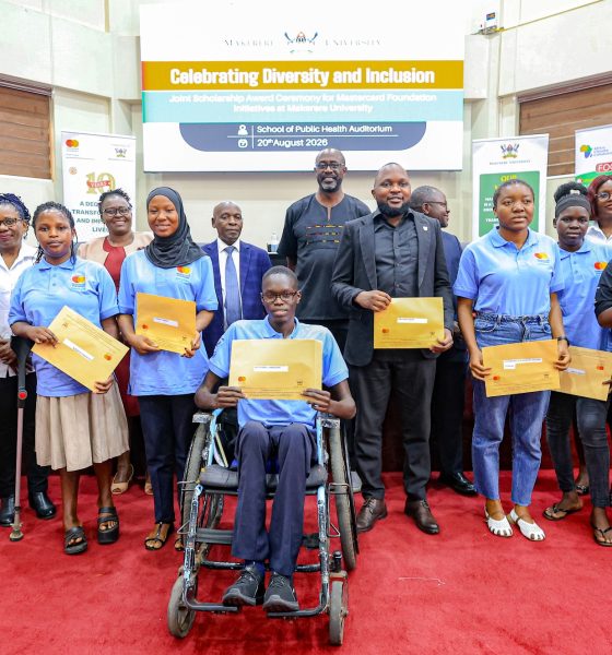 A cross-section of Cohort 9 Scholars pose in a photo with officials shortly after getting their award letters. Award Ceremony for Cohort 9 of 258 recipients of the prestigious Mastercard Foundation scholarship for the 2026/2027 academic, 20th August 2026, Makerere University School of Public Health (MakSPH) Auditorium, Main Campus, Kampala Uganda, East Africa.
