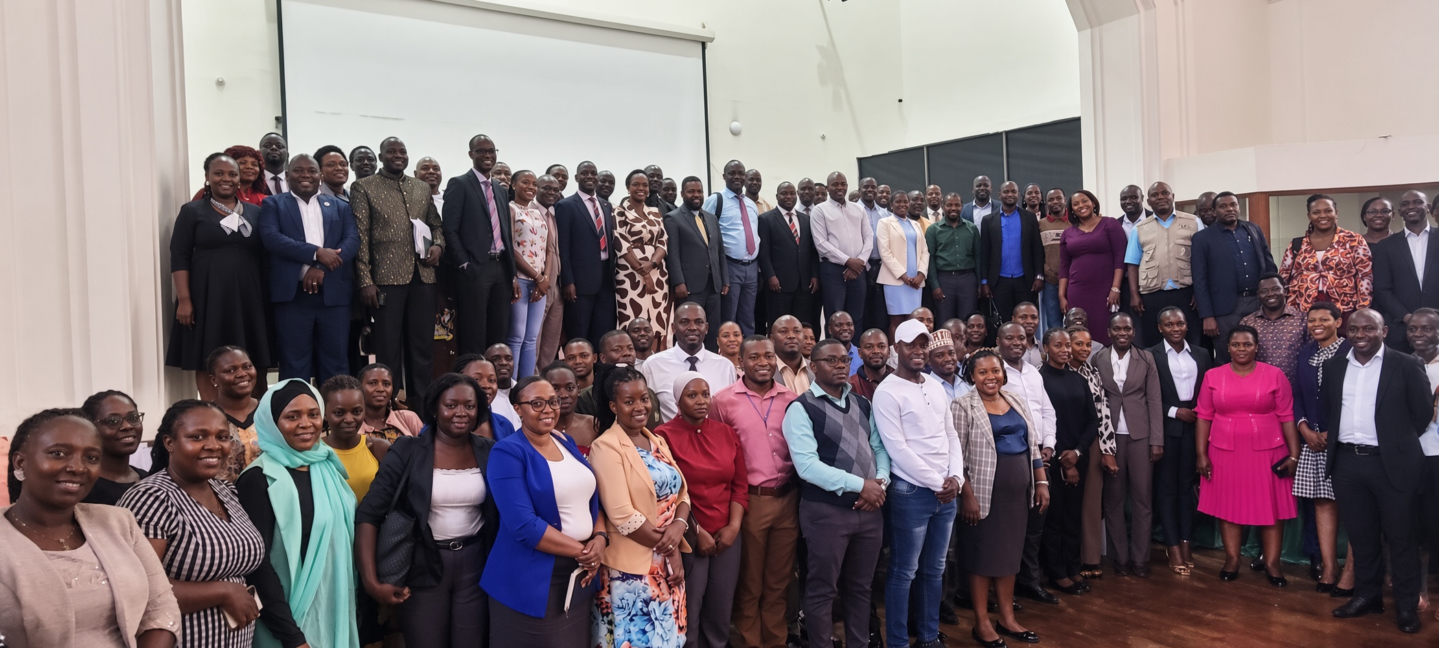 Officials pose for a group photo with the 2026/2027 PhD cohort. Directorate of Graduate Training (DGT) Orientation of the 2026/2027 cohort of PhD students, 10th August 2026, Main Hall, Main Building, Makerere University, Kampala Uganda, East Africa.