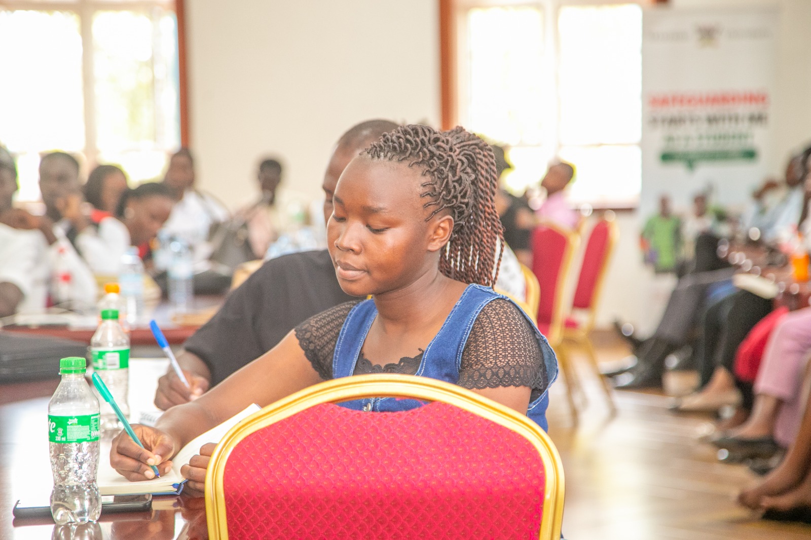 A female Student Safeguarding Champion takes notes. More than 60 Student Safeguarding Champions have undergo intensive training to strengthen efforts aimed at preventing abuse, promoting inclusion and creating a safer learning environment for all students, 31st July 2026, Senior Common Room, Main Building, Makerere University, Kampala Uganda, East Africa.