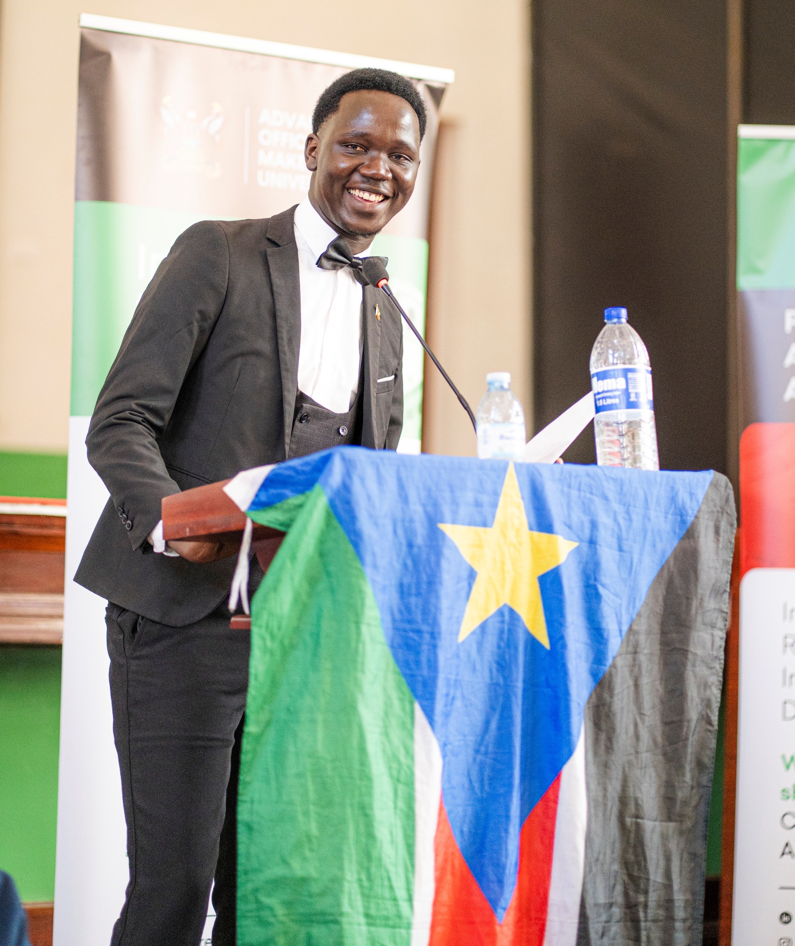 Impeccable! A participant from South Sudan takes to the podium. East African Universities Debate Championships 2026 (EAUDC ZAABU) Closing Ceremony, 31st July 2026, Main Hall, Makerere University, Kampala Uganda.