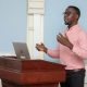 Mak-BSSR PhD-Level beneficiary Khamisi Musanje presents his research during a meeting at the College of Health Sciences (CHS). Makerere University, Kampala Uganda, East Africa.