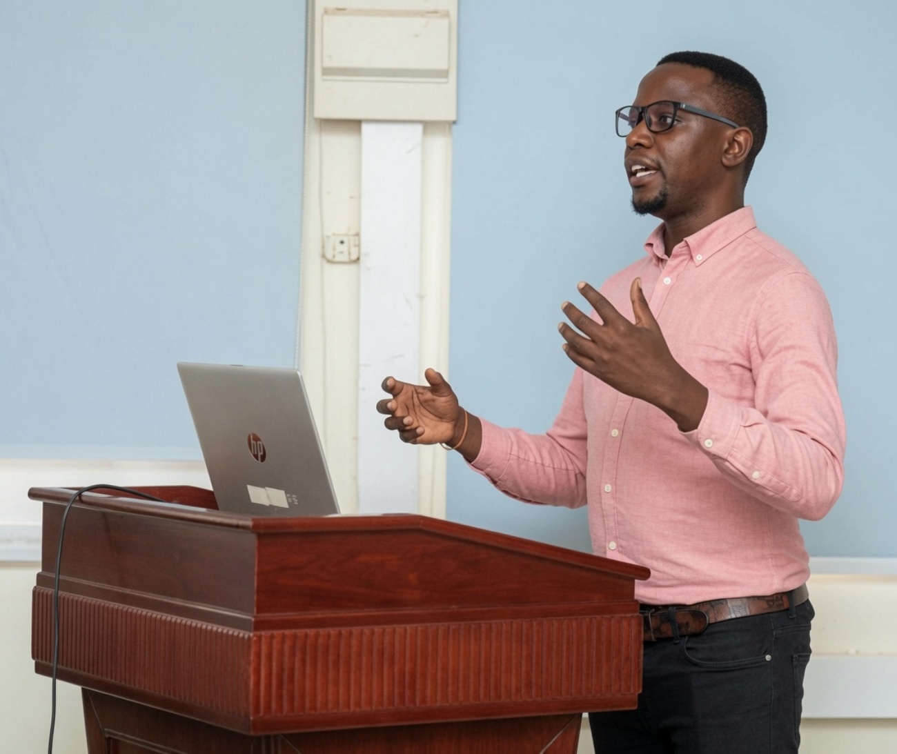 Mak-BSSR PhD-Level beneficiary Khamisi Musanje presents his research during a meeting at the College of Health Sciences (CHS). Makerere University, Kampala Uganda, East Africa.