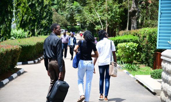Female and male students along the Main Building Walkway on a bright sunny day, 6th May 2026. Makerere University, Kampala Uganda, East Africa.
