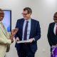 Prof. Barnabas Nawangwe (L) presents Prof. Daniel Branch (C) with the Makerere necktie and Makerere@100 Coffee Table Book as Prof. Fred Masagazi Masaazi (R) witnesses during his visit on 13th February 2026. Makerere University, Kampala Uganda, East Africa.