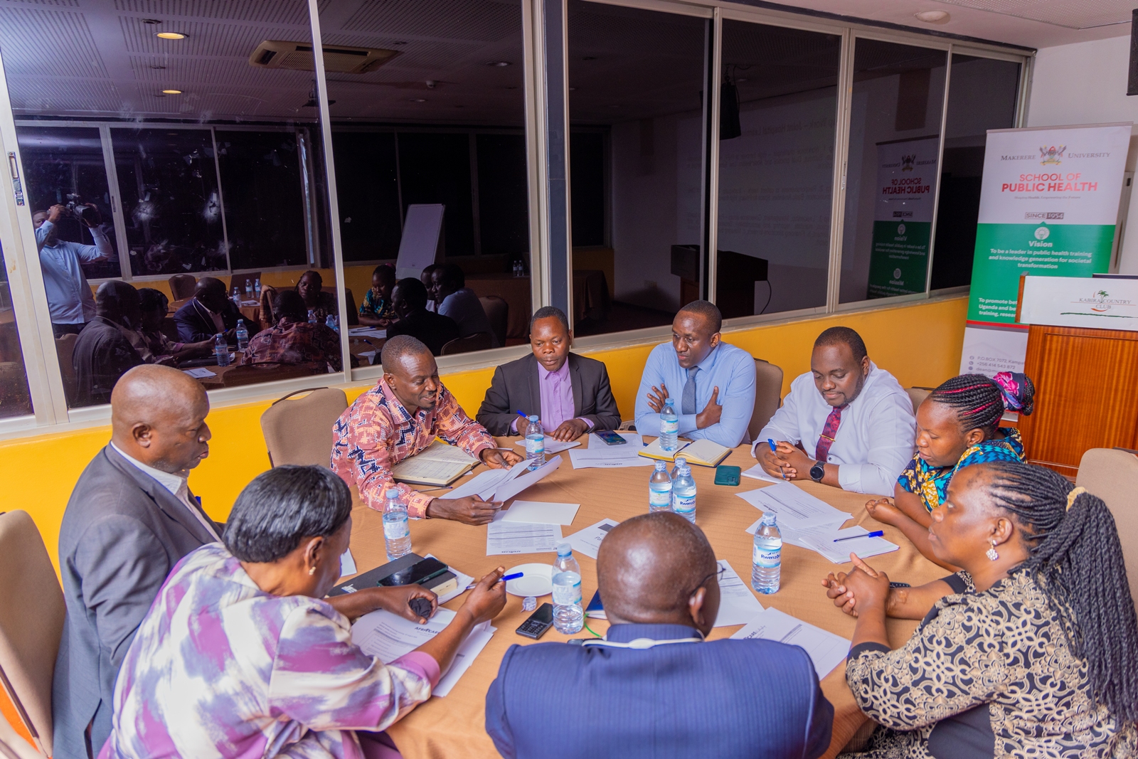 Some of the AFRHiCARE Stakeholders in a group discussion. Makerere University School of Public Health (MakSPH) Wellcome Trust through a 2023–2029 Discovery Award-funded Future of Africa’s First Referral Hospitals: Innovation and Care (AFRHiCARE) research initiative stakeholders from five first-referral hospitals in Uganda meeting to review research findings, reflect on persistent challenges and identify practical solutions to strengthen hospital performance and quality of care, 13th August 2026, Kabira Country Club, Kampala Uganda, East Africa.