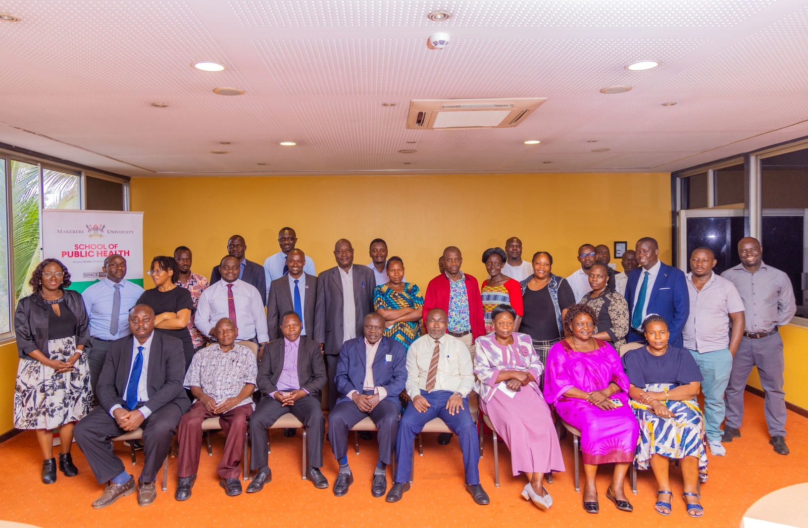 Stakeholders pose for a group photo during the AFRHiCARE Meeting held on 13th August 2026. Makerere University School of Public Health (MakSPH) Wellcome Trust through a 2023–2029 Discovery Award-funded Future of Africa’s First Referral Hospitals: Innovation and Care (AFRHiCARE) research initiative stakeholders from five first-referral hospitals in Uganda meeting to review research findings, reflect on persistent challenges and identify practical solutions to strengthen hospital performance and quality of care, 13th August 2026, Kabira Country Club, Kampala Uganda, East Africa.