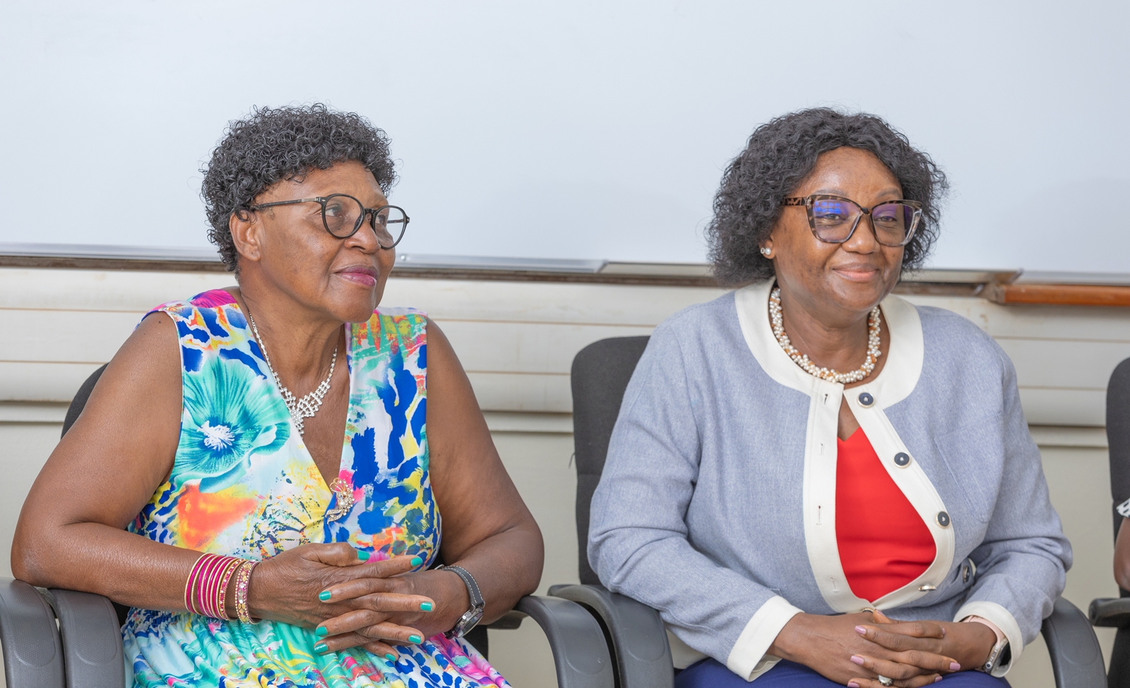 Prof. Rhoda Wanyenze (R) and Claire Nakayizi (L). Celebrating Claire Nakayizi's 14 years of service as Custodian, August 2026, Makerere University School of Public Health (MakSPH), Mulago Hospital Complex, Kampala Uganda, East Africa.