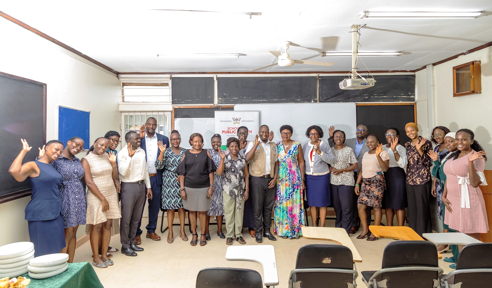 The Dean and Staff of SPH with Claire Nakayizi during the celebration. Celebrating Claire Nakayizi's 14 years of service as Custodian, August 2026, Makerere University School of Public Health (MakSPH), Mulago Hospital Complex, Kampala Uganda, East Africa.