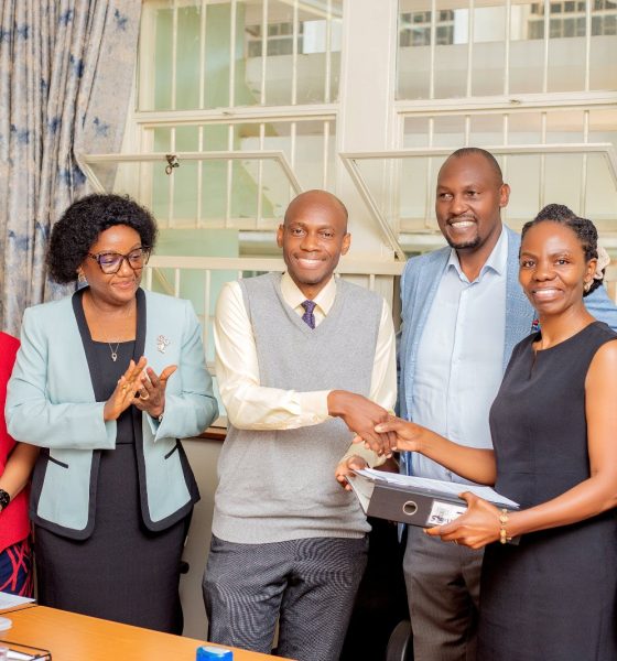 Officials witness as Dr. David Musoke and Dr. Esther Buregyeya shake hands at the handover ceremony on 11th August 2026. Makerere University School of Public Health (MakSPH) leadership transition, Department of Disease Control and Environmental Health, Dr. David Musoke takes over from Dr. Esther Buregyeya, 11th August 2026, Mulago Hospital Complex, Kampala Uganda, East Africa.