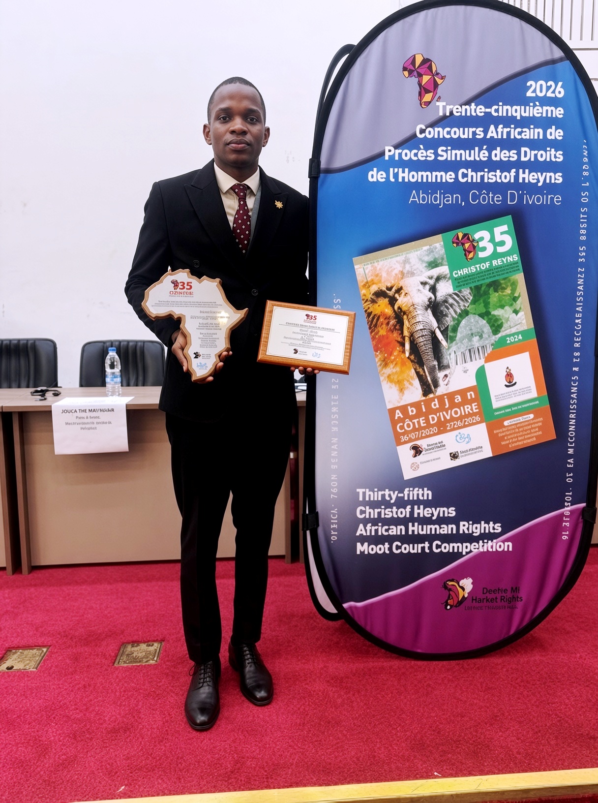 Owen Mayanja with his trophies. Makerere University School of Law (SoL) 1st Runners-Up in the week-long (26 July to 2 August 2026) 35th Christof Heyns All Africa Human Rights Moot Court Competition, Institut Universitaire d’Abidjan in Abidjan, Côte d’Ivoire, West Africa.