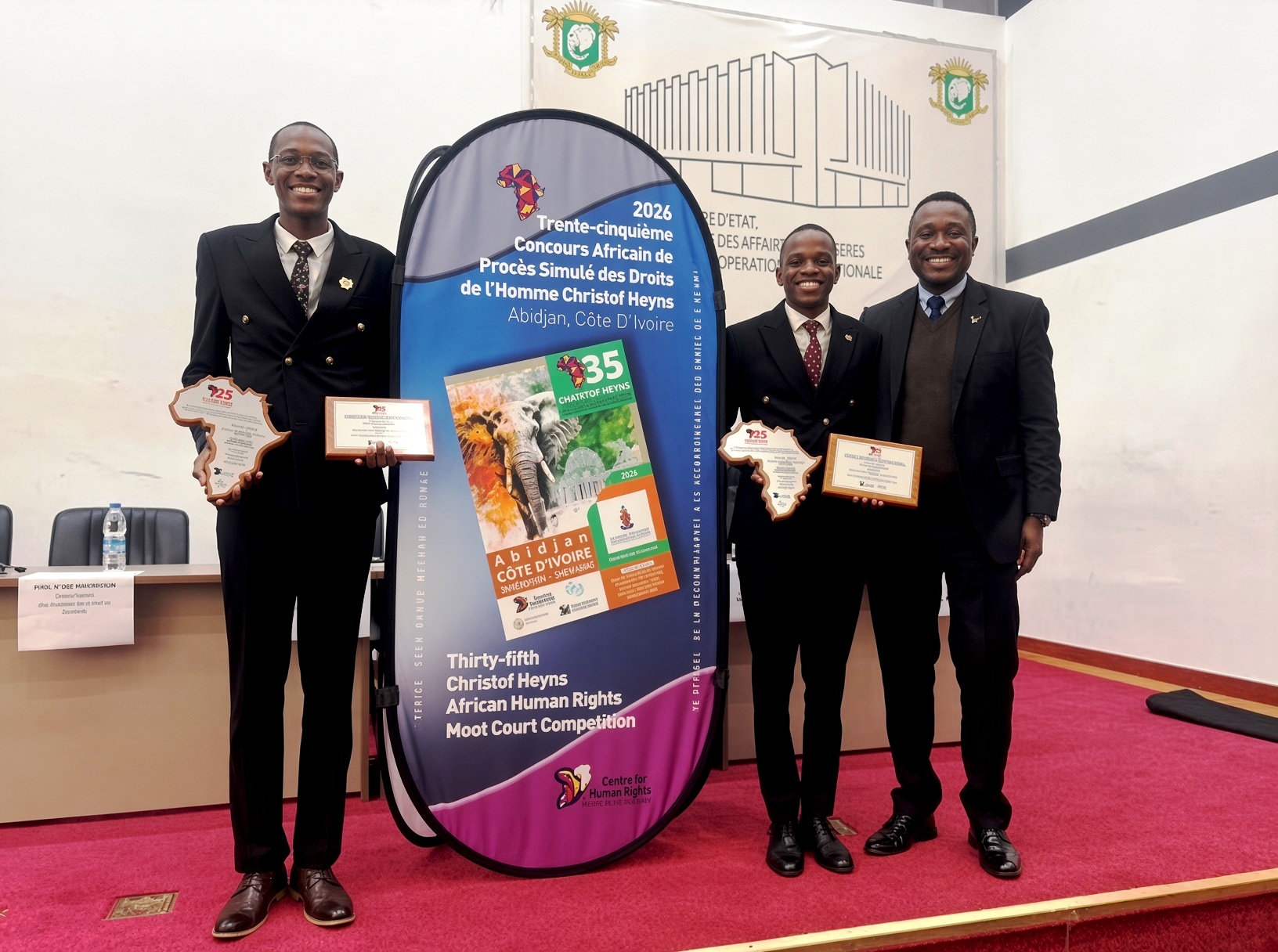 L-R: Conrad Akesigaruhanga, Owen Mayanja with Dr. Daniel Ruhweza. Makerere University School of Law (SoL) 1st Runners-Up in the week-long (26 July to 2 August 2026) 35th Christof Heyns All Africa Human Rights Moot Court Competition, Institut Universitaire d’Abidjan in Abidjan, Côte d’Ivoire, West Africa.