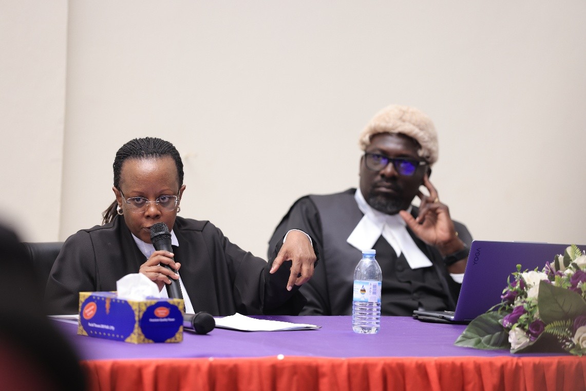 Hon. Lady Justice Patricia Mutesi (left) giving feedback to the teams at the Moot. Inaugural Digital Health Inter-University Moot Court Competition Held in partnership with the University of Warwick and supported by the Wellcome Trust, 12–13 August 2026, School of Law (SoL), Makerere University, Kampala Uganda, East Africa.