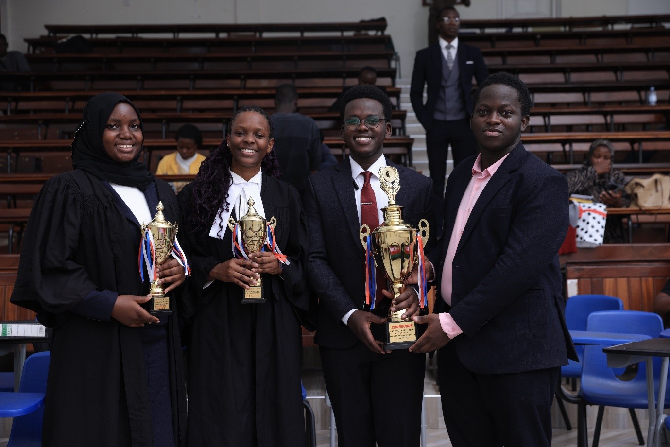 L-R: Musamba Irene Blessing (IUIU student), Olga Asianut Blessing (best oralist) with SoL students. Inaugural Digital Health Inter-University Moot Court Competition Held in partnership with the University of Warwick and supported by the Wellcome Trust, 12–13 August 2026, School of Law (SoL), Makerere University, Kampala Uganda, East Africa.