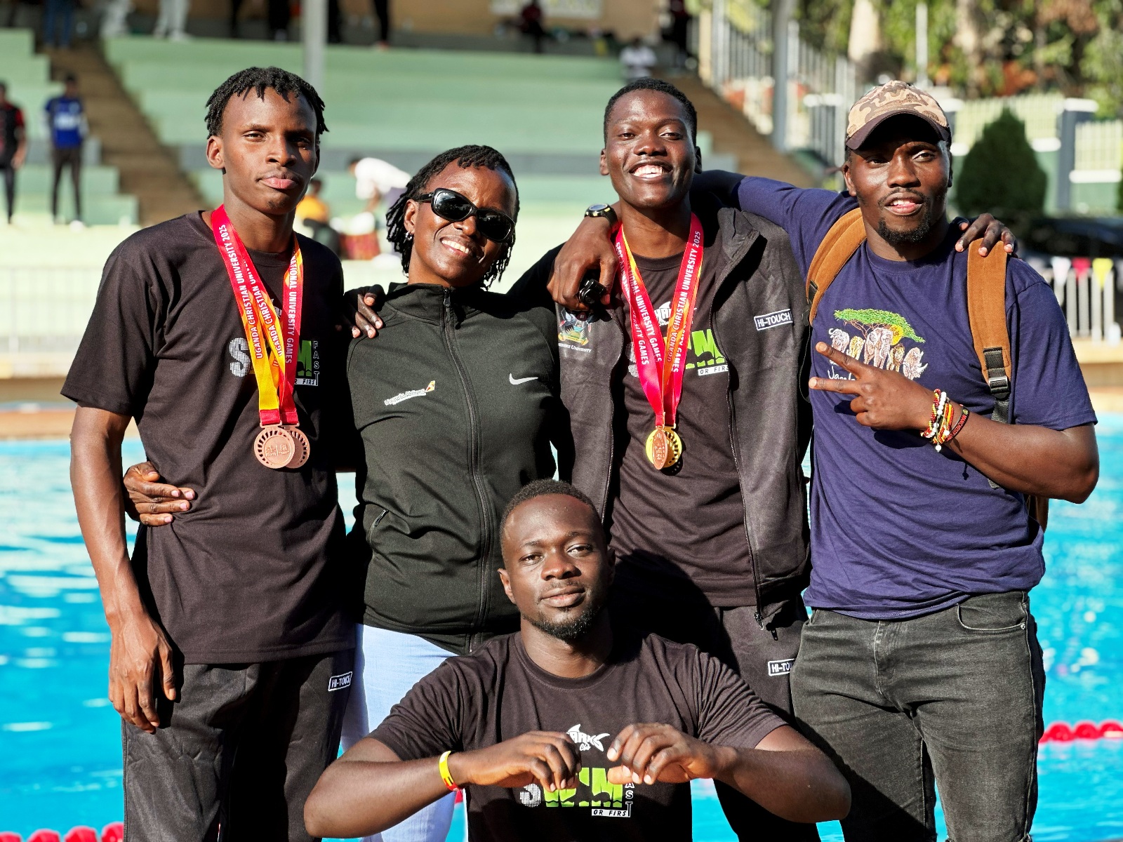 Mak Sharks Swim Team with their medals at Seroma High School after winning Gold at the AUUS Games at the AUUS Games held 18th to 23rd December, 2025 at Uganda Christian University (UCU) Mukono. Sports and Recreation Department, Makerere University, Kampala Uganda, East Africa.