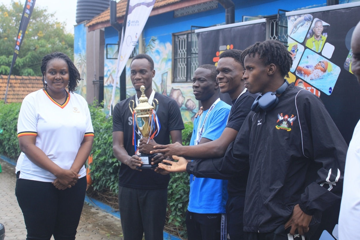 Part of the Mak Sharks Men receive their trophy at the UA Inaugural meet in April. Makerere University's Sports Excellence continues, Newsletter (April-June 2026), Kampala Uganda, East Africa.
