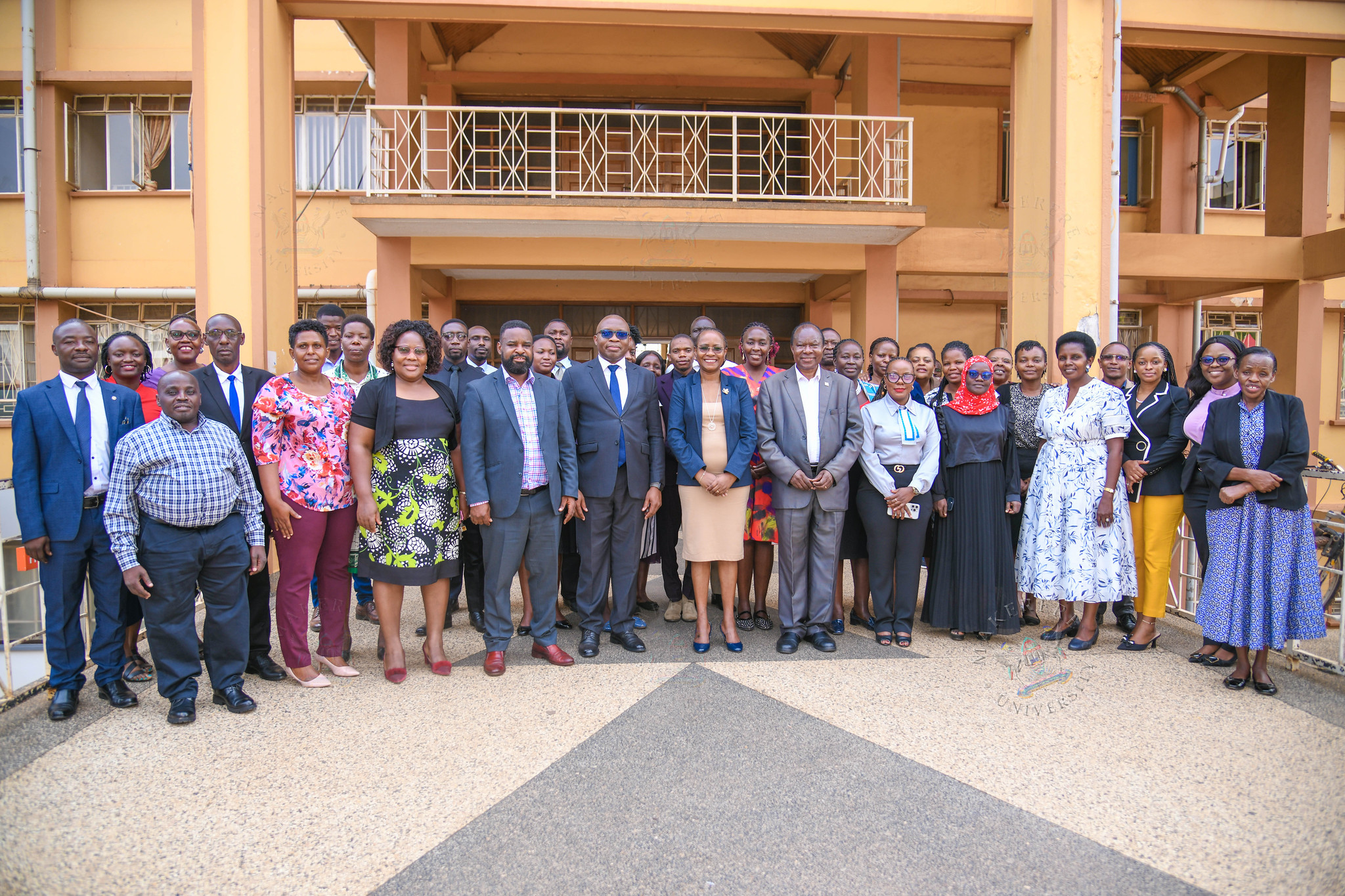 Prof. Sarah Ssali (C) with Prof. Fredrick Jones Muyodi, the MakWC Team and Workshop Participants. Makerere University Writing Center (MakWC) minutes writing toolkit workshop for executive and administrative staff, opened by DVCAA Prof. Sarah Ssali, 4th August, 2026, Telepresence Hall, Senate Building, Makerere University, Kampala Uganda, East Africa.