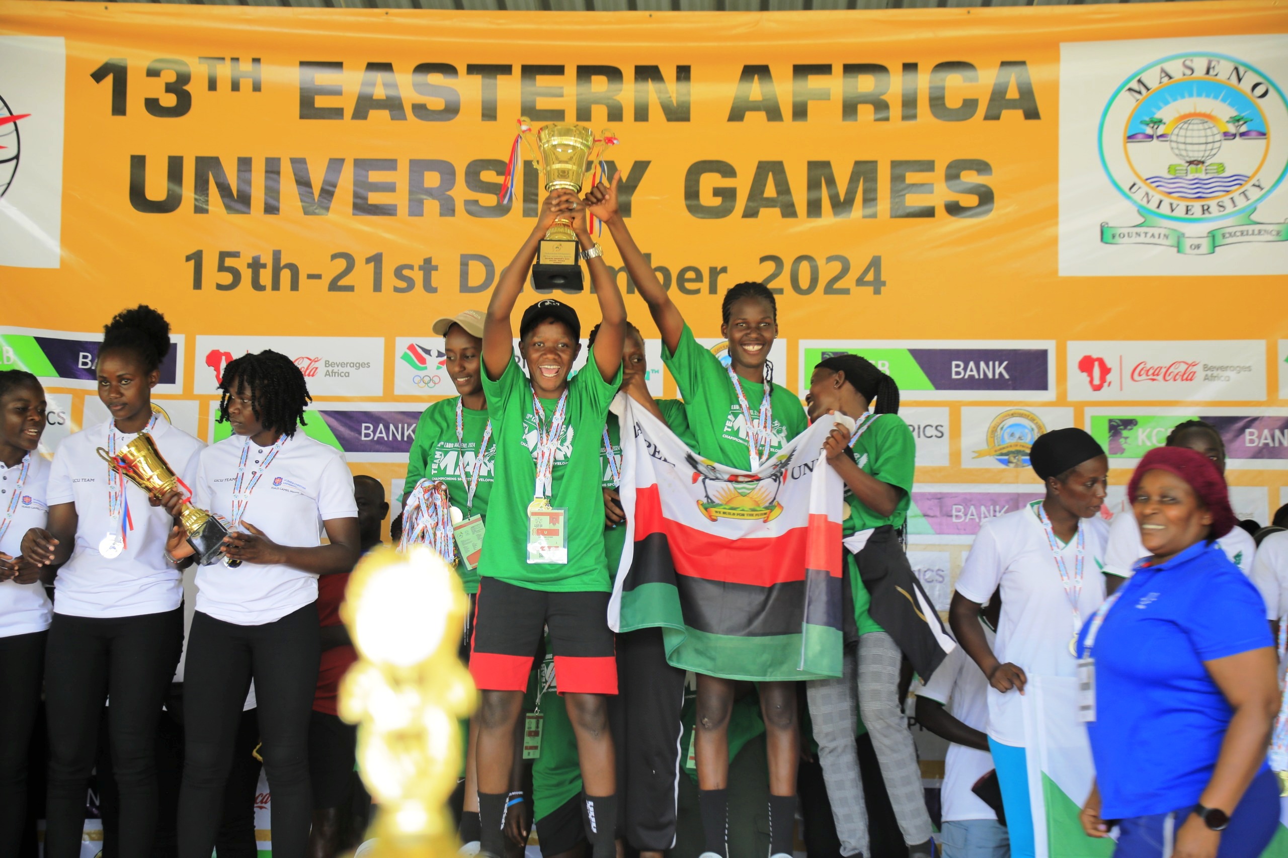 Makerere Women Soccer Team Members lift their trophy at the Award Ceremony during the previous FEAUS games. Makerere University Games Union at 13th Federation of East African University Sports (FEAUS) Games, 15th-21st December 2024, Maseno University, Kisumu County, Kenya, East Africa.