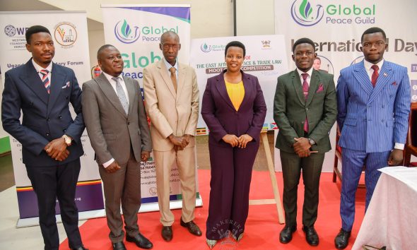 Officials pose for a group photo at the International Day of Peace celebrations on 21st September 2026. 92nd Guild Security Ministry in partnership with the Global Peace Guild International Day of Peace 2026 and Launch of the East African Peace and Trade Law Moot Court Competition, presided over by Minister of State for East African Community Affairs, Hon. James Magode Ikuya represented by Dr. Andrew Musiime, 21st September 2026, Main Hall, Main Building, Makerere University, Kampala Uganda, East Africa.