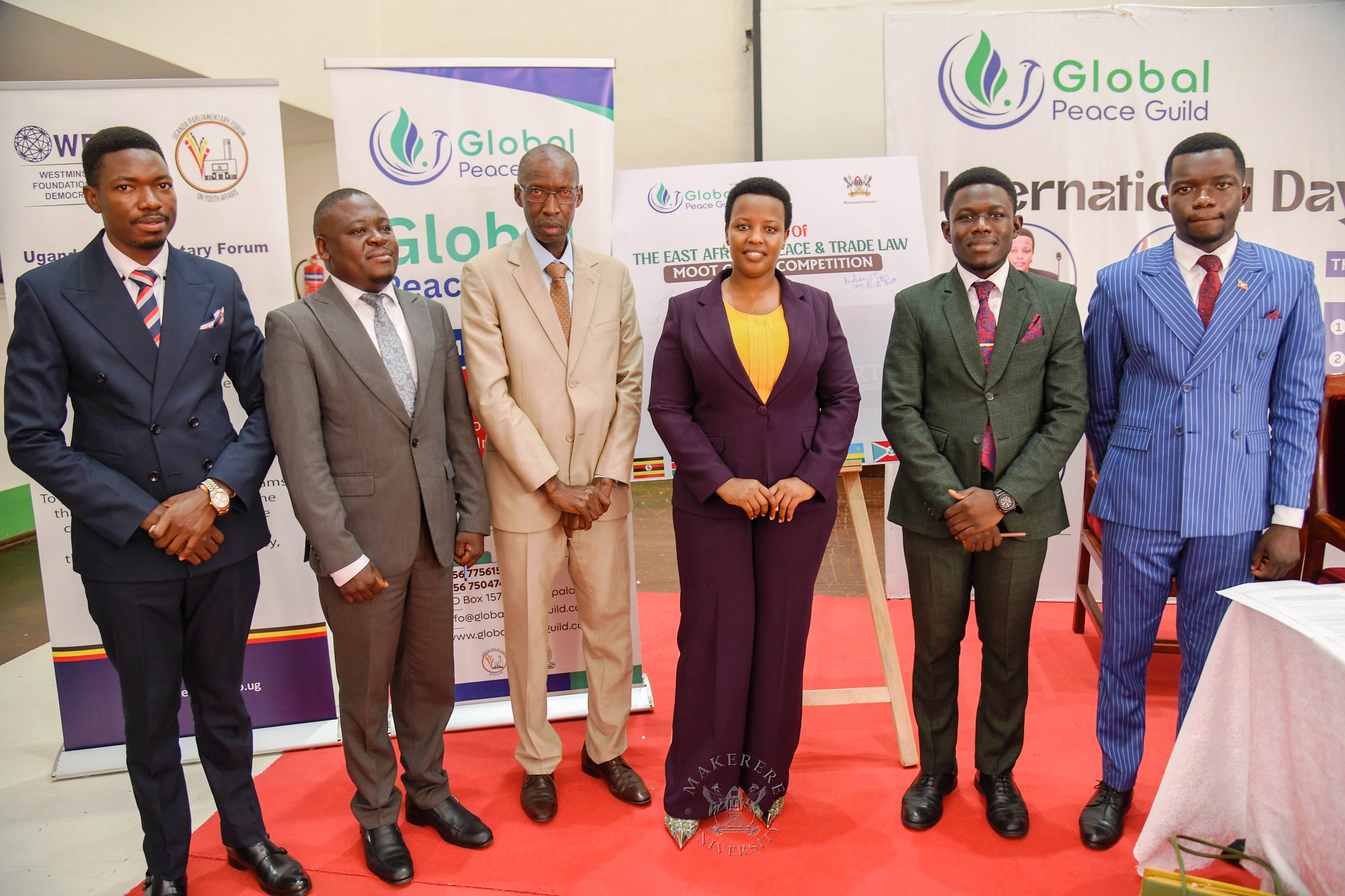 Officials pose for a group photo at the International Day of Peace celebrations on 21st September 2026. 92nd Guild Security Ministry in partnership with the Global Peace Guild International Day of Peace 2026 and Launch of the East African Peace and Trade Law Moot Court Competition, presided over by Minister of State for East African Community Affairs, Hon. James Magode Ikuya represented by Dr. Andrew Musiime, 21st September 2026, Main Hall, Main Building, Makerere University, Kampala Uganda, East Africa.