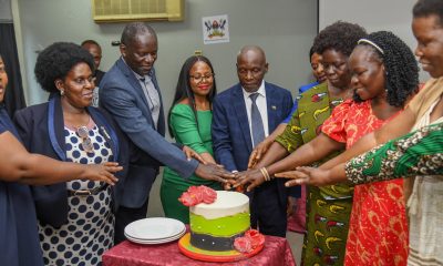 Mr. Charles Ssentongo (C) and Ms. Betty Akoli (3rd R) are joined by Staff and Family to cut cake at the farewell luncheon on 18th September 2026. Farewell Luncheon held by Department of Academic Registrar in honour of Mr. Charles Ssentongo, Deputy Academic Registrar – Undergraduate Admissions and Records and Ms. Betty Akoli, Assistant Academic Registrar presided over by Ag. Academic Registrar Ms. Prossie Nakayiki, 18th September 2026, Senate Conference Hal, Level 4, Senate Building, Makerere University, Kampala Uganda, East Africa.