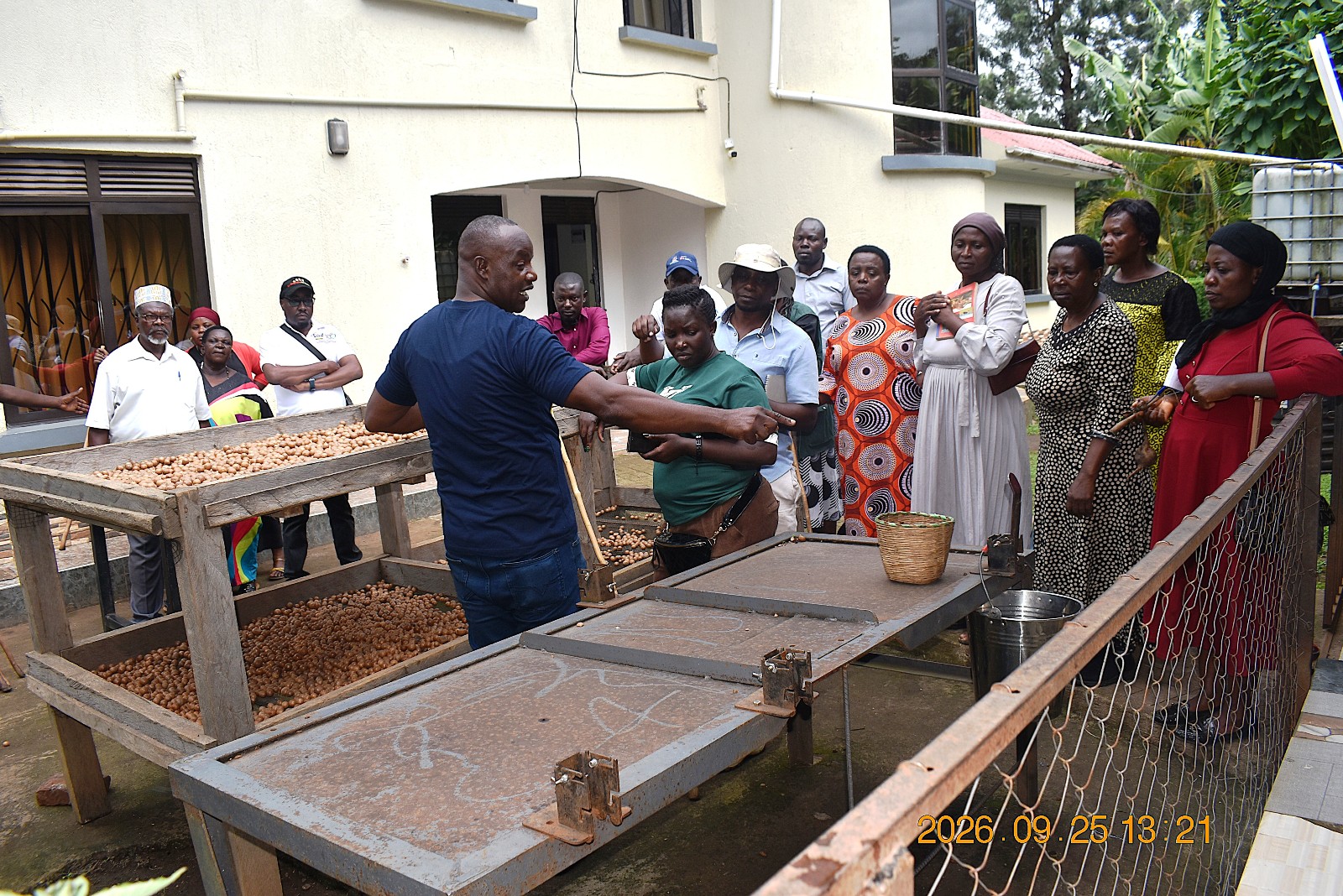Mr. Bigabwa takes the team through the process of adding value to macadamia nuts. Farmers from Mbale City four-day learning exchange programme in Kasese Municipality and Kabarole District to gain new approaches to strengthening urban food production, 23rd-26th September 2026, supported by the Resilient Urban Food Systems (RUFS) Project, led by Prof. Frank Mugagga, Department of Geography, Geo-Informatics and Climatic Sciences, College of Agricultural and Environmental Sciences (CAES), Makerere University, Kampala Uganda, East Africa.