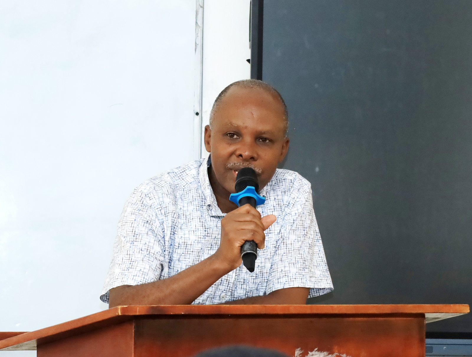 The Project Coordinator, Dr. Levis Mugumya addressing the new cohort during the orientation. College of Humanities and Social Sciences (CHUSS) orientation of 10 new Gerda Henkel Foundation PhD fellows, CHUSS Smart Room, 7th September 2026, Makerere University, Kampala Uganda, East Africa.