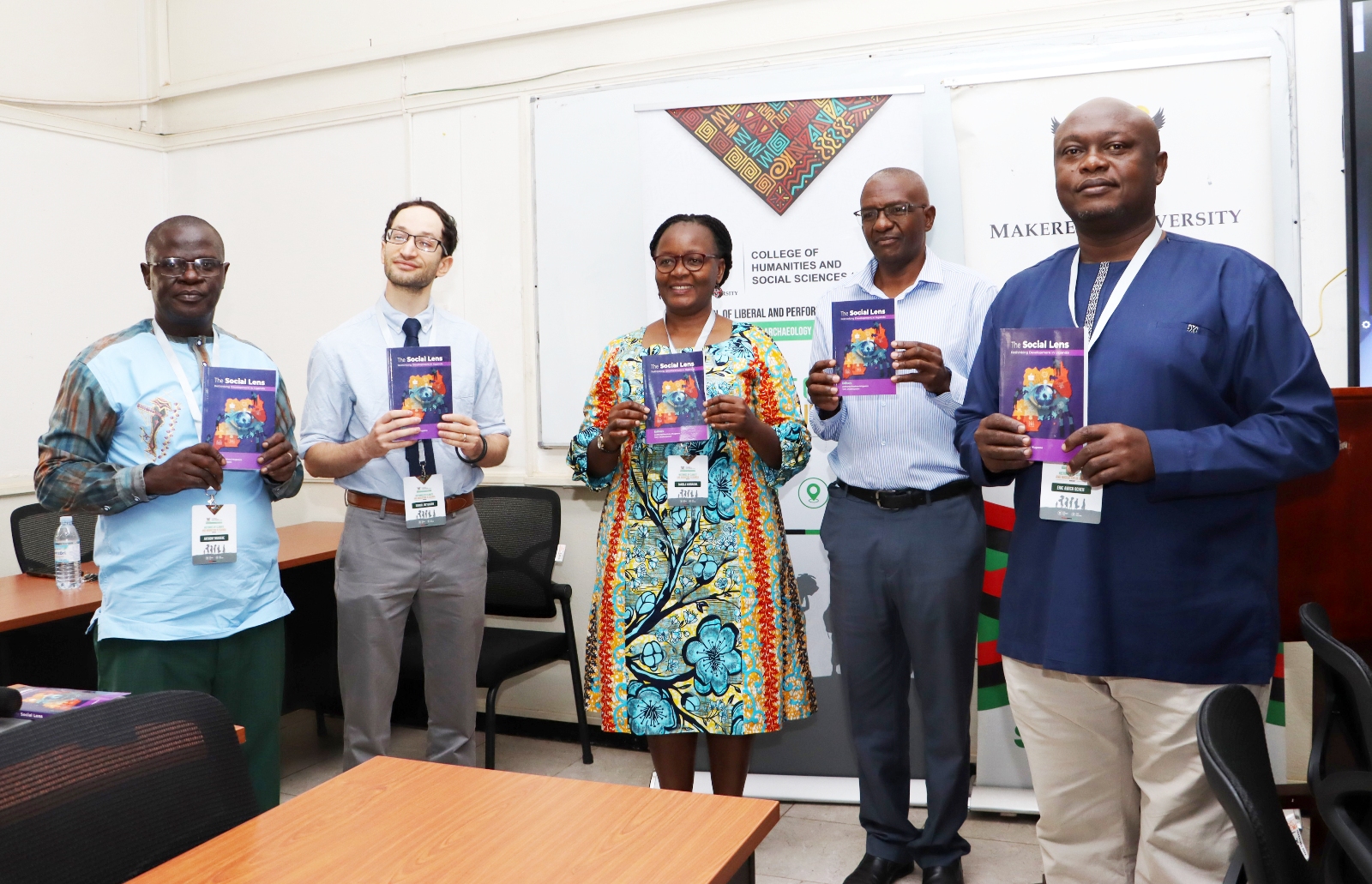 Dr. Anthony Mugeere, the key note speaker poses with university officials holding copies of his publication. Opening Ceremony of three-day workshop hosted by the Department of History, Archaeology and Heritage Studies, School of Liberal and Performing Arts, College of Humanities and Social Sciences (CHUSS) examining the historical relationship between climate change and migration in Uganda, under a joint project between Makerere University and the University of Cambridge, CHUSS Smart Room, 8th-10th September 2026, Kampala Uganda, East Africa.
