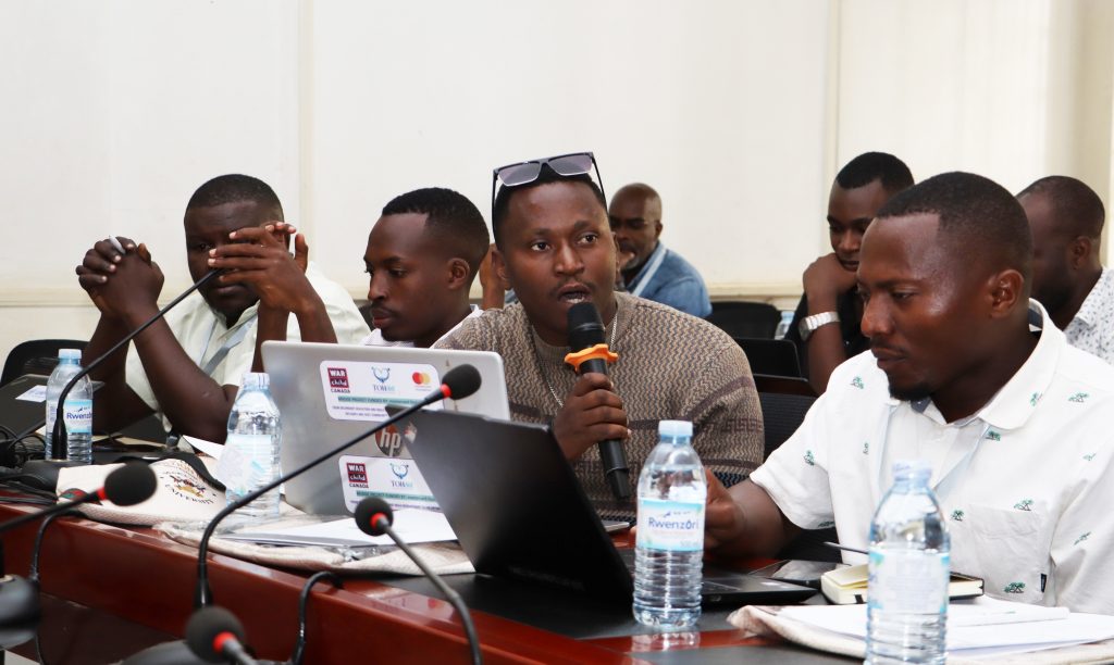 One of the participants asking questions to the keynote speaker. Opening Ceremony of three-day workshop hosted by the Department of History, Archaeology and Heritage Studies, School of Liberal and Performing Arts, College of Humanities and Social Sciences (CHUSS) examining the historical relationship between climate change and migration in Uganda, under a joint project between Makerere University and the University of Cambridge, CHUSS Smart Room, 8th-10th September 2026, Kampala Uganda, East Africa.
